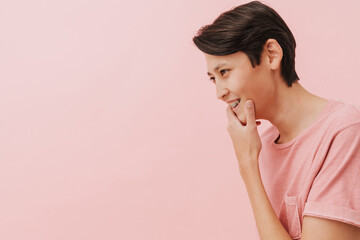 Asian brunette boy with dental brace smiling and looking aside