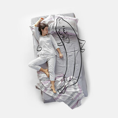 Creative image. Top view of young woman lying on bed, sleeping, dreaming about healthy lifestyle