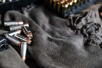 Fototapeta na wymiar 9mm conceal semi automatic gun with jacket hallow point bullet