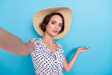 Portrait of attractive pretty lady recording video arm palm demonstrate empty space isolated on blue color background