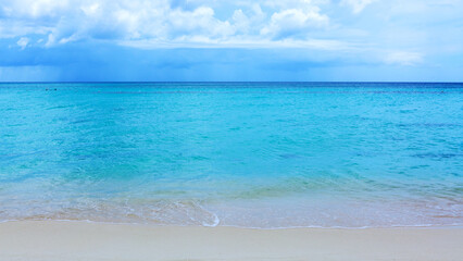Fototapeta na wymiar Travel background with clouds sky and Caribbean sea.