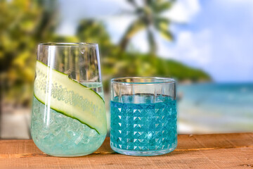 Summer beach blue koteil stands on a wooden bar counter