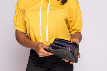 broke african lady holding her empty wallet