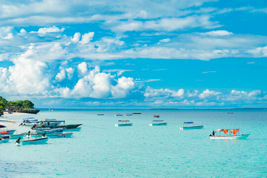 Fishing ship and boats near the beach of Indian ocean in the morning. Zanzibar, Tanzania
