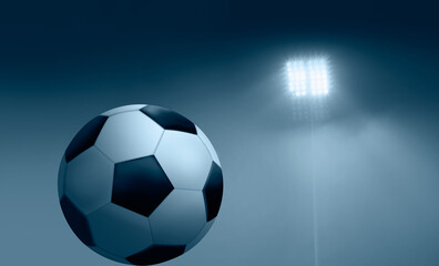 Fototapeta na wymiar Soccer (football) ball is under the projector 