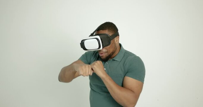 Young black man in virtual reality glasses