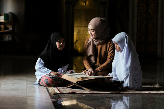 An Asian Muslim girl is learning to read the Quran with a female teacher. of them in the mosque.