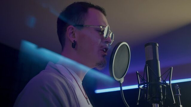 Talented young singer records songs in professional studio