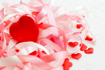 Happy Mother's Day or Happy women's day. Valentine's day. Red heart on the background of blurred holiday ribbons on white background. Banner for store. Greeting card.