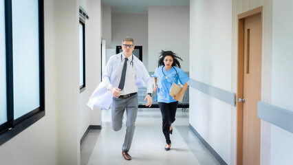 The doctor found a case of an emergency patient, so he ran with the assistant nurse to rush to the...