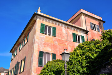 Fototapeta na wymiar characteristic colored house in the promenade of genoa nervi italy