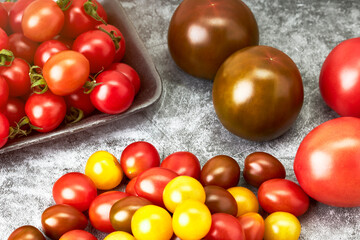 Naklejka na ściany i meble Tray with cherry tomatoes of various colors. Vegetarian and vegan food