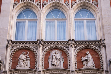 Munich, Germany -April 27,2022: Details of stone ornaments on the facades of baroque buildings in the German city Munich which is the capital city in Bavaria.