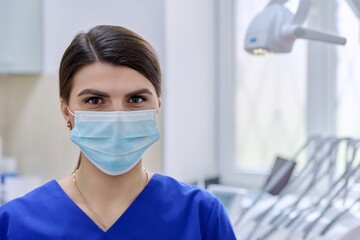 Fototapeta na wymiar Portrait of confident female dentist doctor in office looking at camera