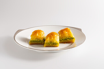 Close up shot to pistachio baklava, Turkish dessert, traditional foods concept
