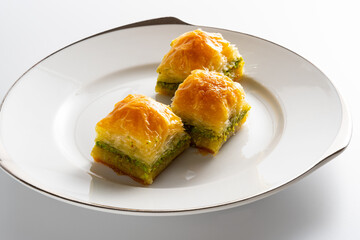 Close up shot to pistachio baklava, Turkish dessert, traditional foods concept