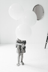 Little girl with white air balloons. Where are you concept