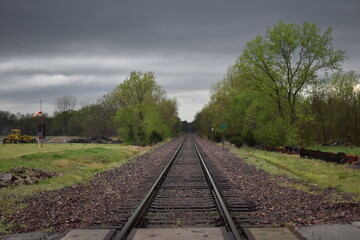 Obraz premium Storm Clouds Over Train Tracks
