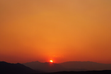 Majestic panorama of mountain landscape at sunset. Dramatic sky.