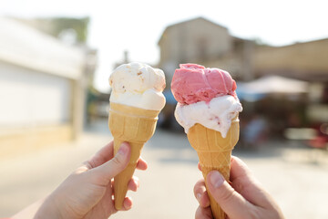 Person holding nut and berry ice cream. Cold healthy dessert is favorite summer treat