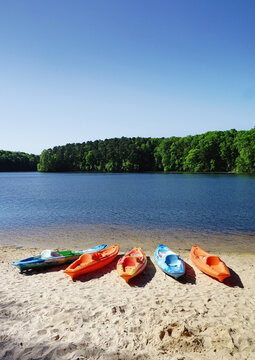 Colorful kayaks on the shore of Lake Johnson, a popular city park in Raleigh NC