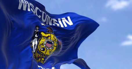 The US state flag of Wisconsin waving in the wind.
