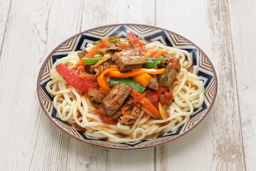 Laghman, hand pulled noodles dish with lamb meat and vegetables, Uyghur cuisine