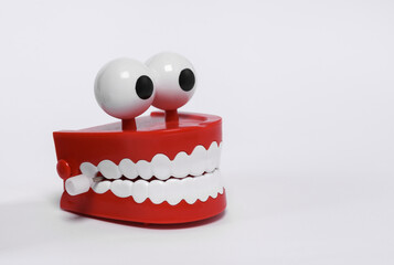 Funny, joke clockwork jaw isolated on white background