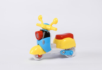 Small retro moped model isolated on white background.