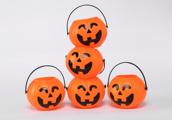 Stack of plastic jack'o lantern candy buckets for halloween. Trick or Treat