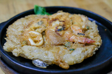 Thai Style Seafood omelette Hot Plate serve in the restaurant