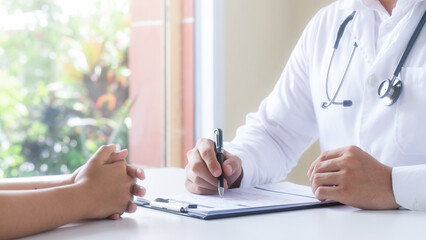 The doctor talks to patient, recommends treatment analyzes medical reports A thorough physical...