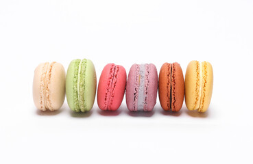 Set of colored macaroons isolated on white background. French sweet delicacy.