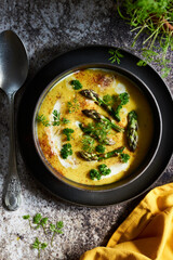 asparagus soup with dill and parsley leaves