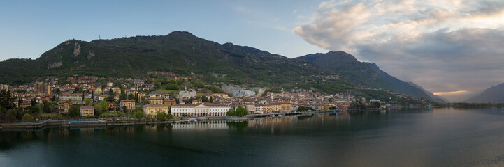 Fototapeta na wymiar Aerial view of Lake Iseo at sunrise,panorama of all the city of lovere which runs along the lake,Bergamo Italy.
