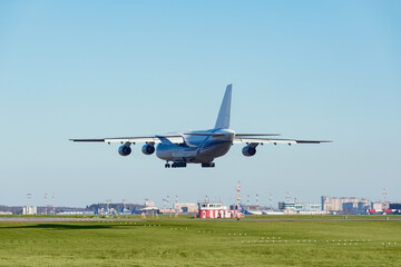 Landing of the big cargo airliner in the airport.
