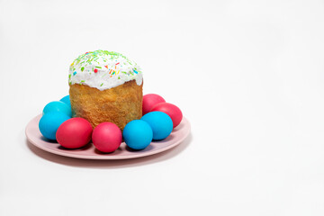 Fototapeta na wymiar Easter cake and painted eggs on a white background, copy the place for the text