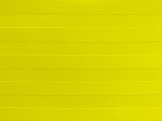 yellow velvet pattern fabric texture used as background. Empty yellow  fabric background of soft and smooth textile material. There is space for text.