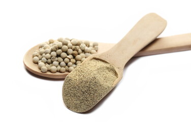 Milled and grain white pepper powder pile, peppercorn isolated on white  