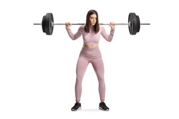 Sporty female standing and lifting heavy weights