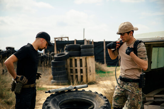 Teammates getting ready for a game of airsoft