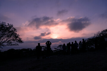 Fototapeta na wymiar silhouette of a couple walking on the sunset
