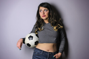 Woman posing with soccer ball