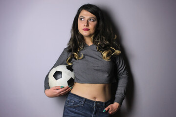 Woman posing with soccer ball