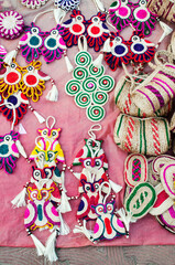 Fototapeta na wymiar KOLKATA, WEST BENGAL , INDIA - DECEMBER 14TH 2013 : Artworks of handicraft, on display during the Handicraft Fair in Kolkata - the biggest handicrafts fair in Asia.