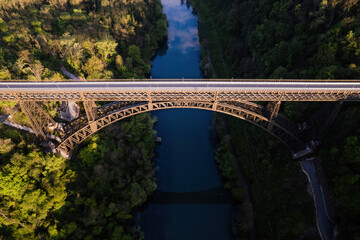 Fototapeta na wymiar San Michele bridge over Adda river aerial view.
