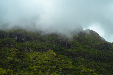 Mist and low clouds hang over the beautiful green mountains of Kipu on the Hawaiian Island of Kauai