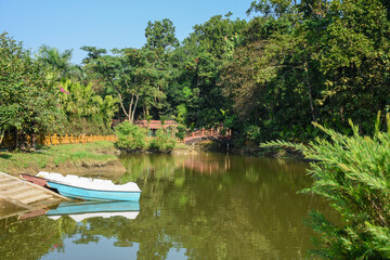 Fototapeta na wymiar Boats in Green Lake with clear water, in Lataguri resort