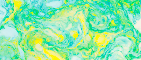 Fluid art creative background. Turquoise yellow spots on liquid. Abstract background with multi-colored stains. Chaos concept