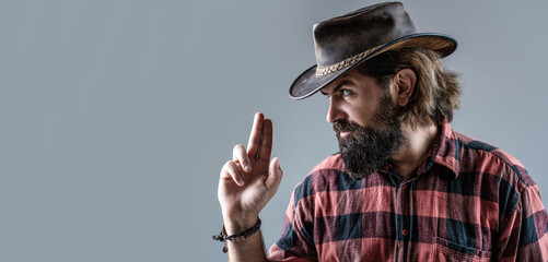 West, guns. Portrait of a cowboy. American bandit in mask, western man with hat. Portrait of cowboy...